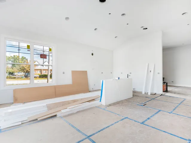 a view of workspace with window and cabinet