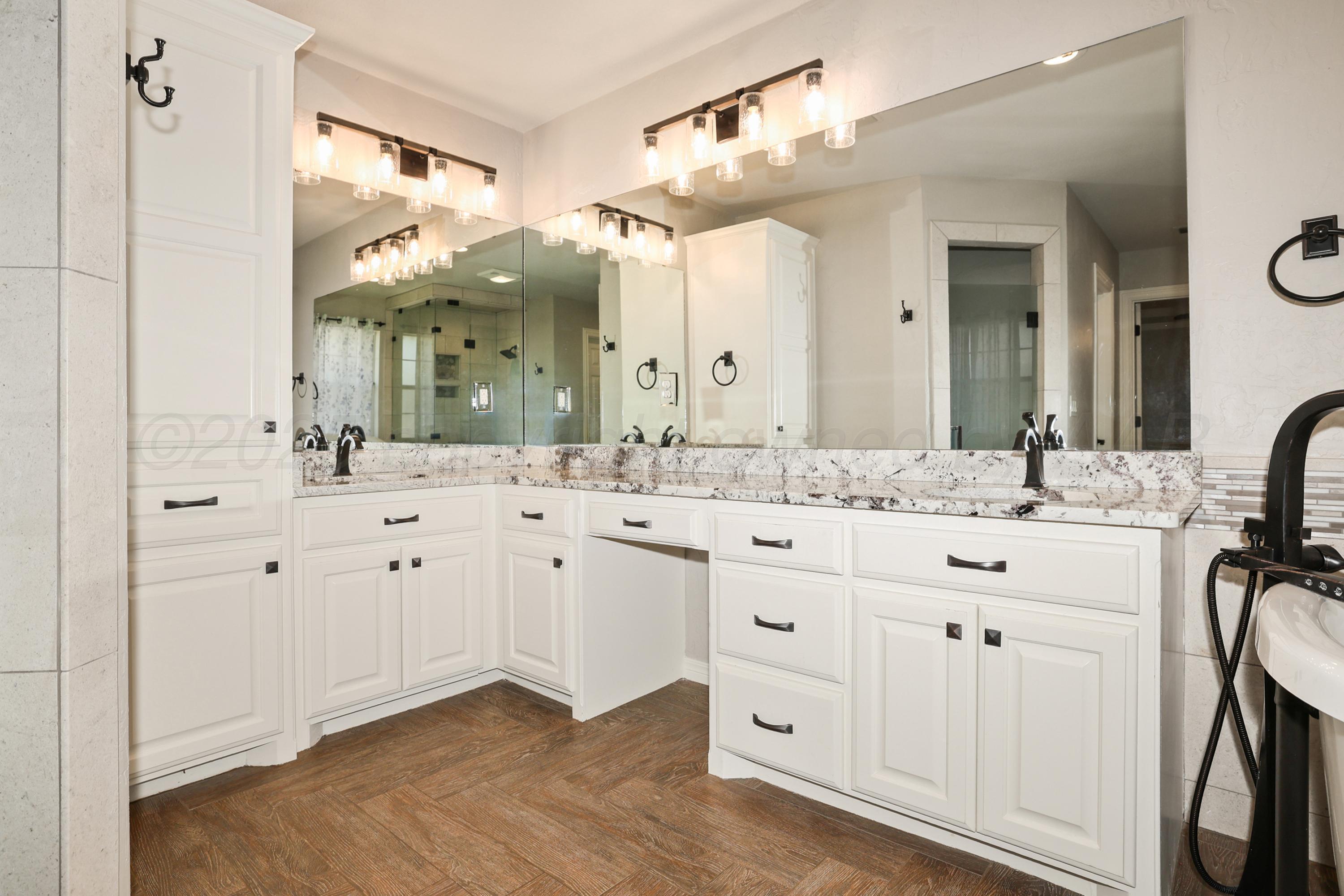 6506 Bayberry Lane Amarillo, TX 79124 - Photo 18 of 32 a bathroom with a double vanity sink mirror and