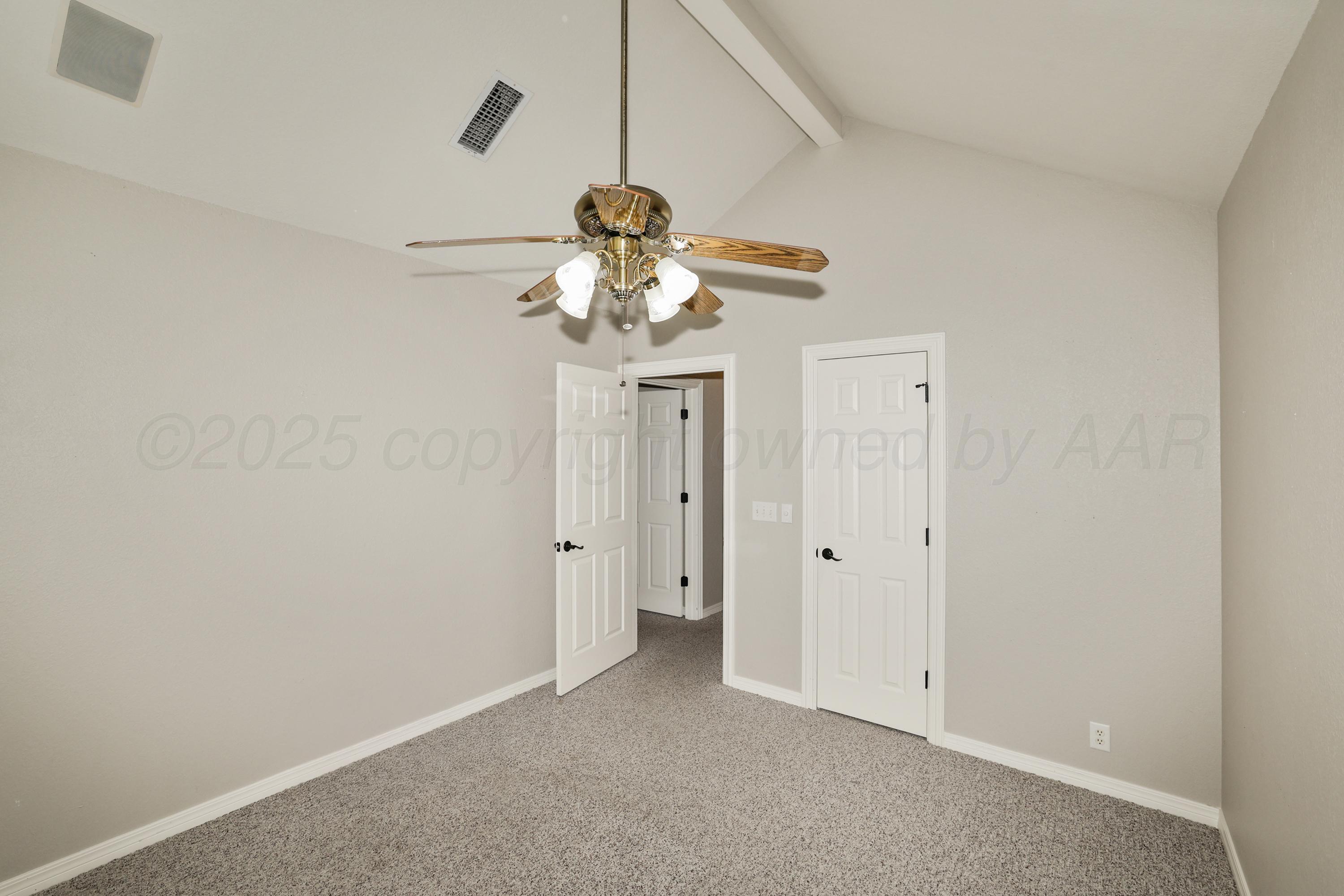6506 Bayberry Lane Amarillo, TX 79124 - Photo 23 of 32 a view of a chandelier fan and closet in a room