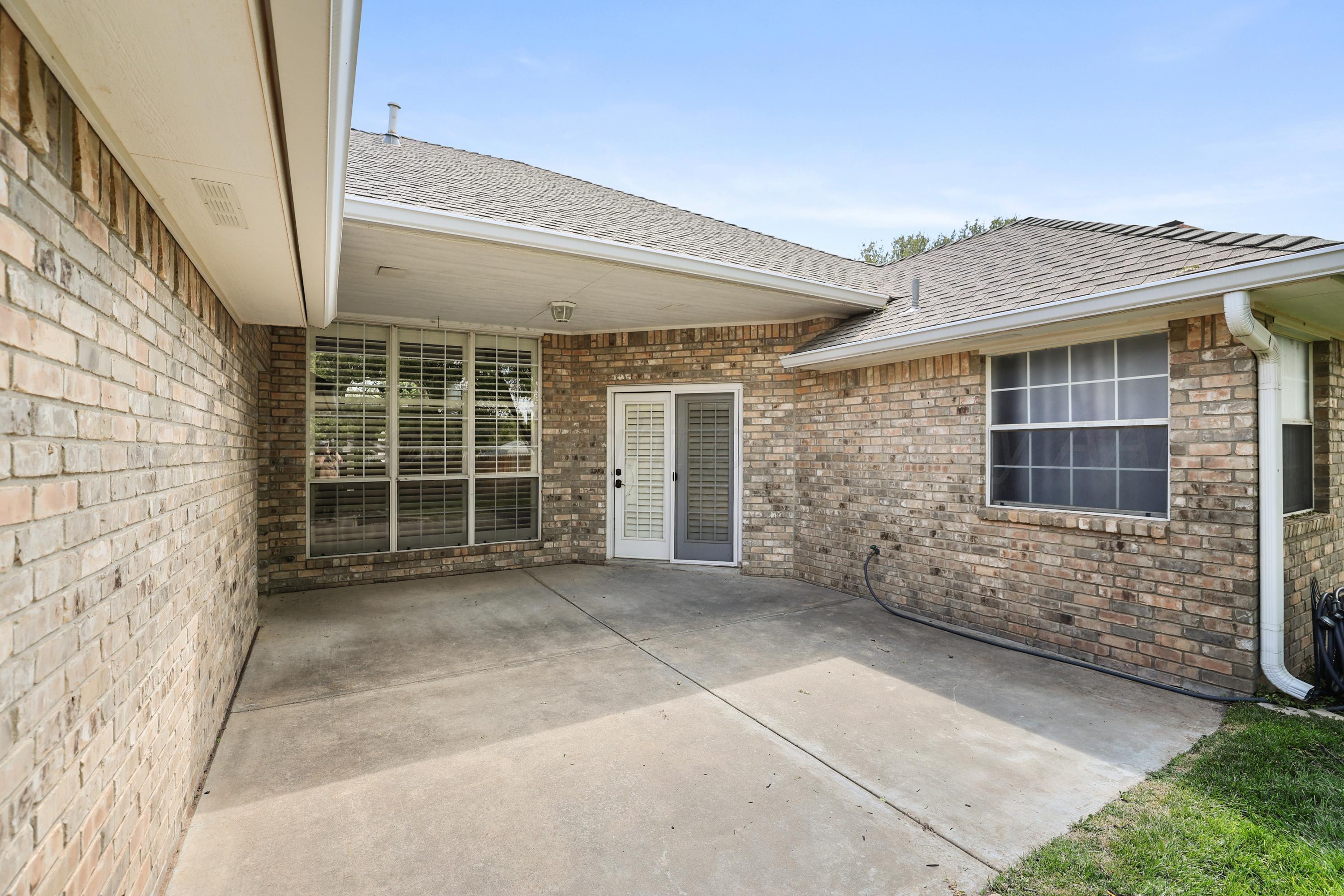 6506 Bayberry Lane Amarillo, TX 79124 - Photo 29 of 32 a view of a house with a yard