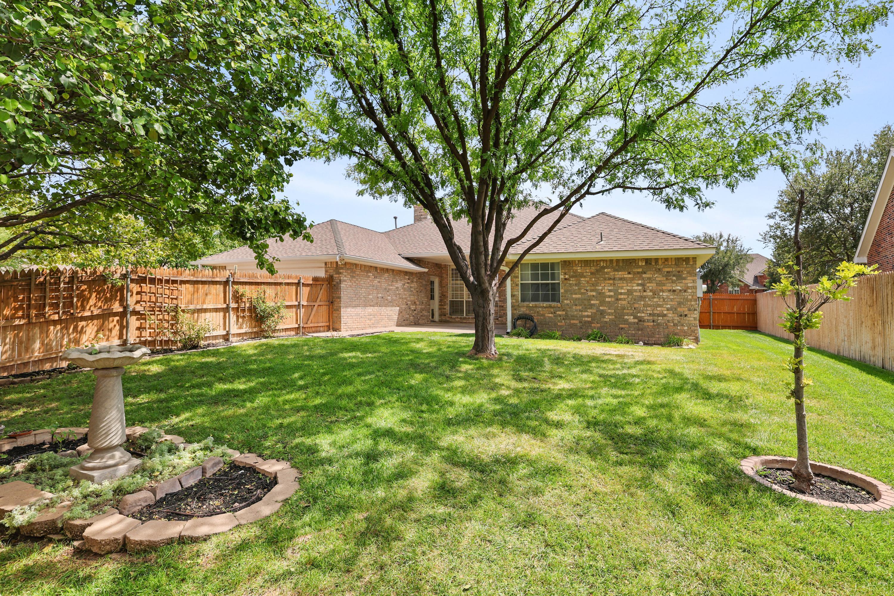6506 Bayberry Lane Amarillo, TX 79124 - Photo 31 of 32 a front view of a house with a yard