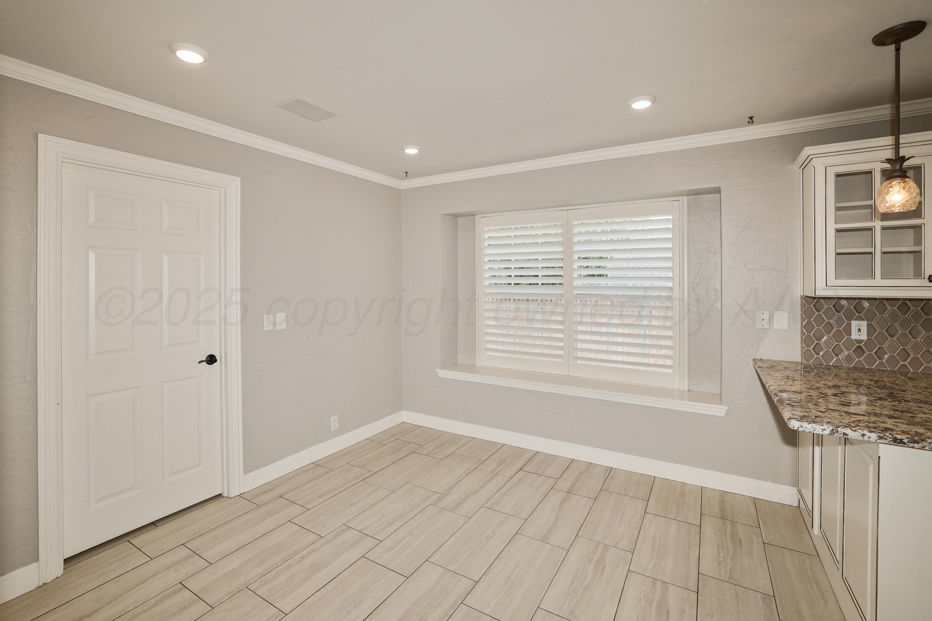 6506 Bayberry Lane Amarillo, TX 79124 - Photo 9 of 32 a view of an empty room with a window