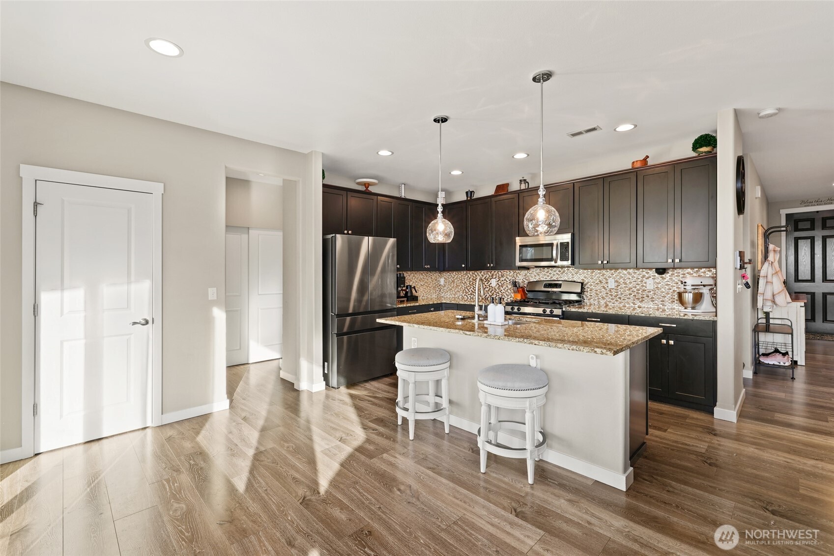 1320 34th Street Southeast Puyallup, WA 98372 - Photo 11 of 40 a large kitchen with a table and chairs