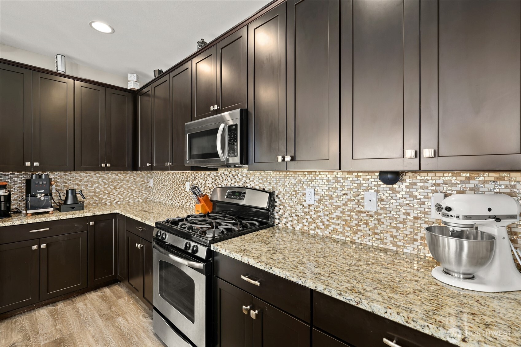 1320 34th Street Southeast Puyallup, WA 98372 - Photo 14 of 40 a kitchen with granite countertop stainless steel appliances and sink