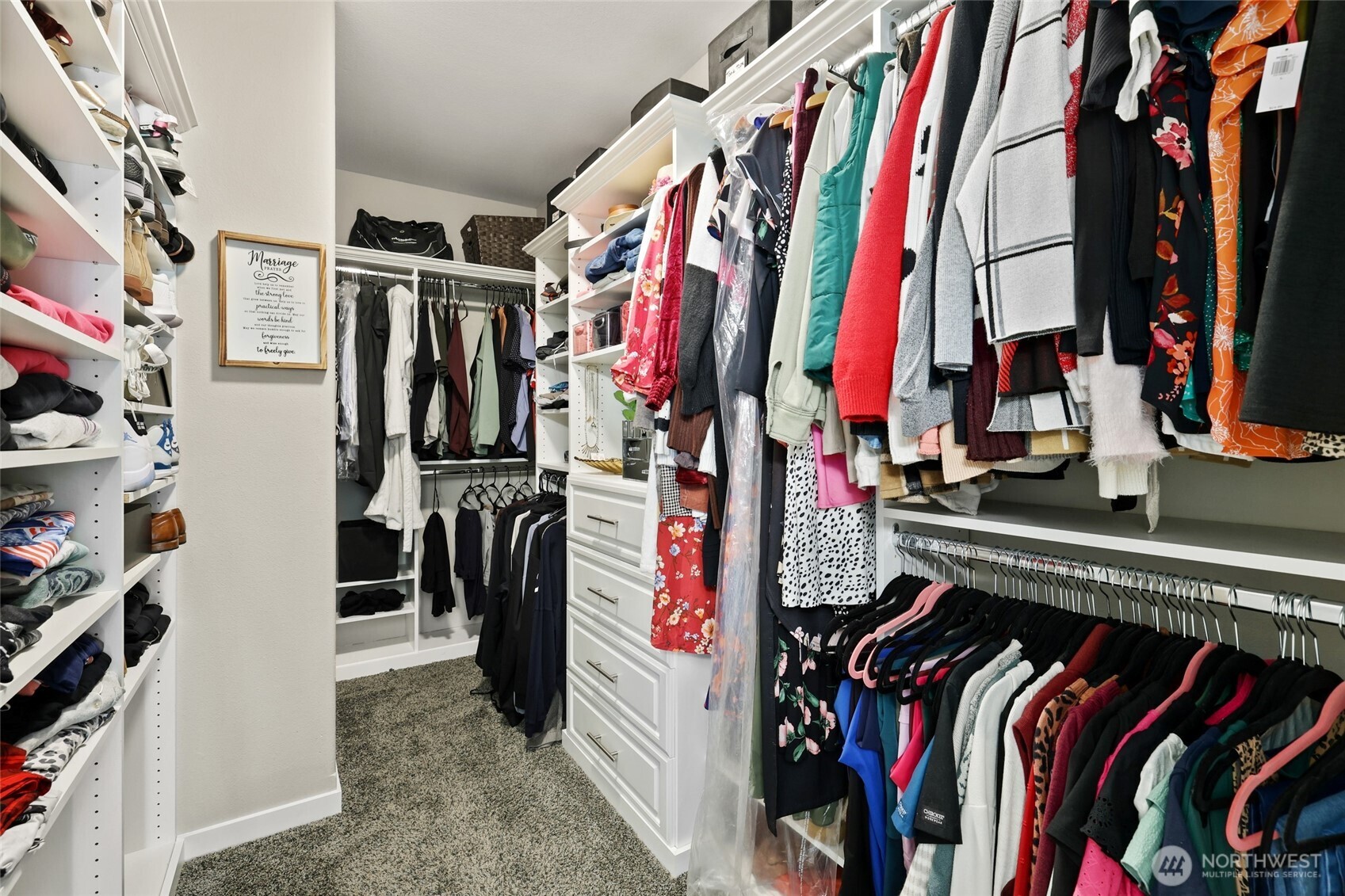 1320 34th Street Southeast Puyallup, WA 98372 - Photo 22 of 40 a view of walk in closet with clothes and shoes