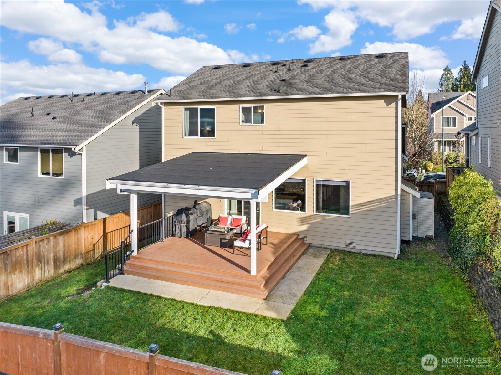 1320 34th Street Southeast Puyallup, WA 98372 - Photo 31 of 40 a front view of a house with a yard table and chairs