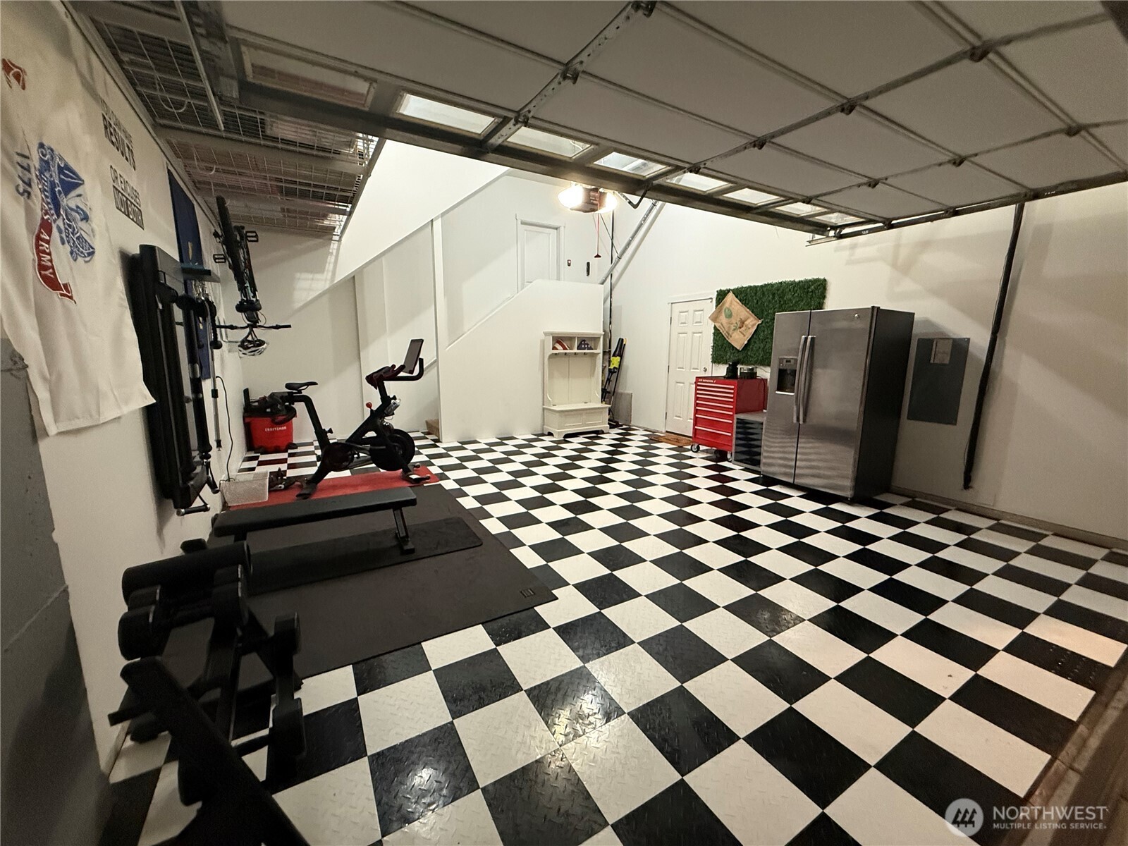 1320 34th Street Southeast Puyallup, WA 98372 - Photo 34 of 40 a bedroom with a black white checkered floor