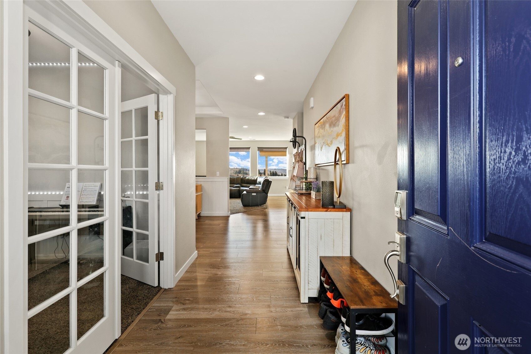 1320 34th Street Southeast Puyallup, WA 98372 - Photo 4 of 40 a view of a living room with furniture and wooden floor