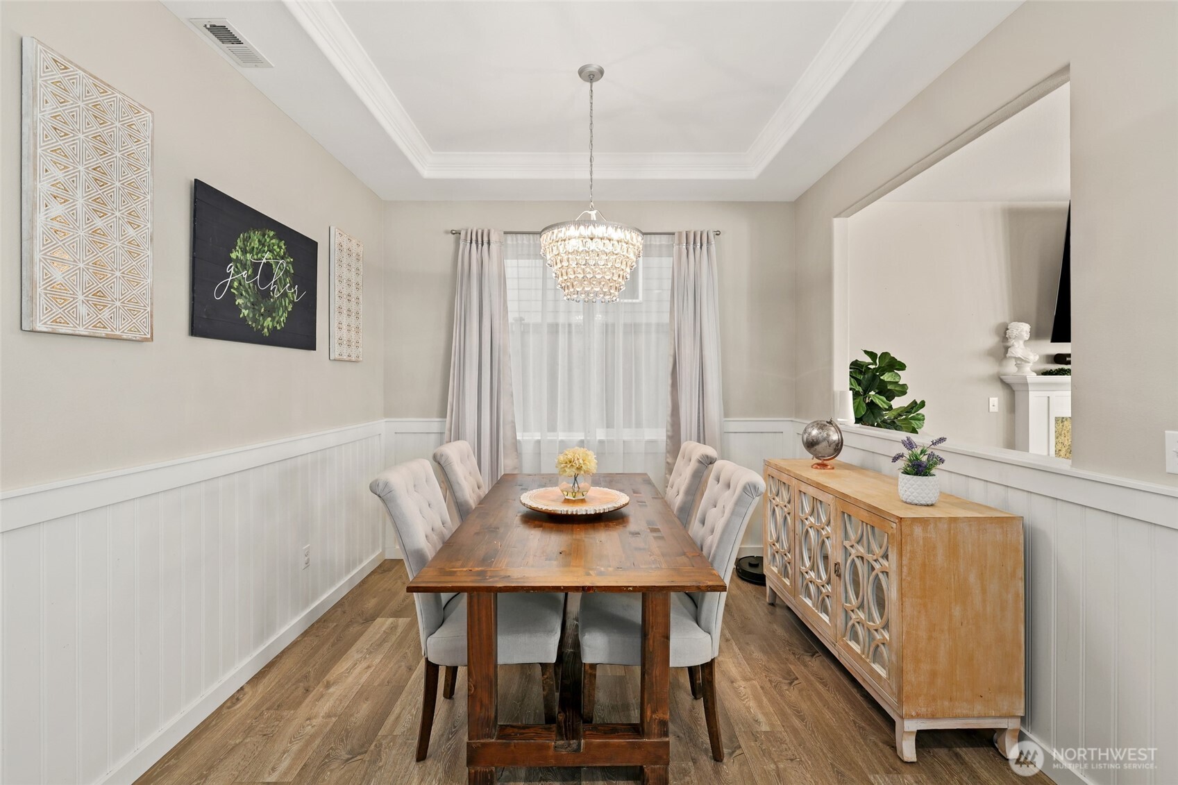 1320 34th Street Southeast Puyallup, WA 98372 - Photo 6 of 40 a view of a dining room with furniture window and wooden floor