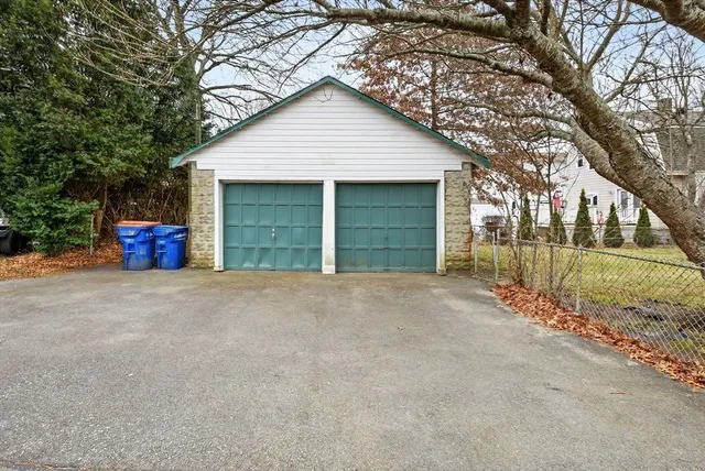 a view of large house with a yard and garage