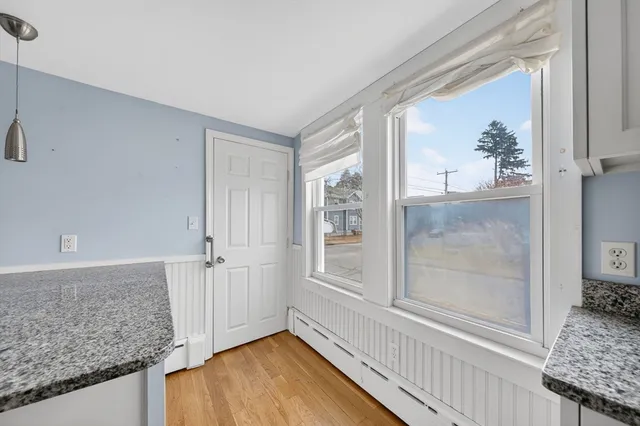 a kitchen with stainless steel appliances granite countertop a refrigerator a sink and a stove