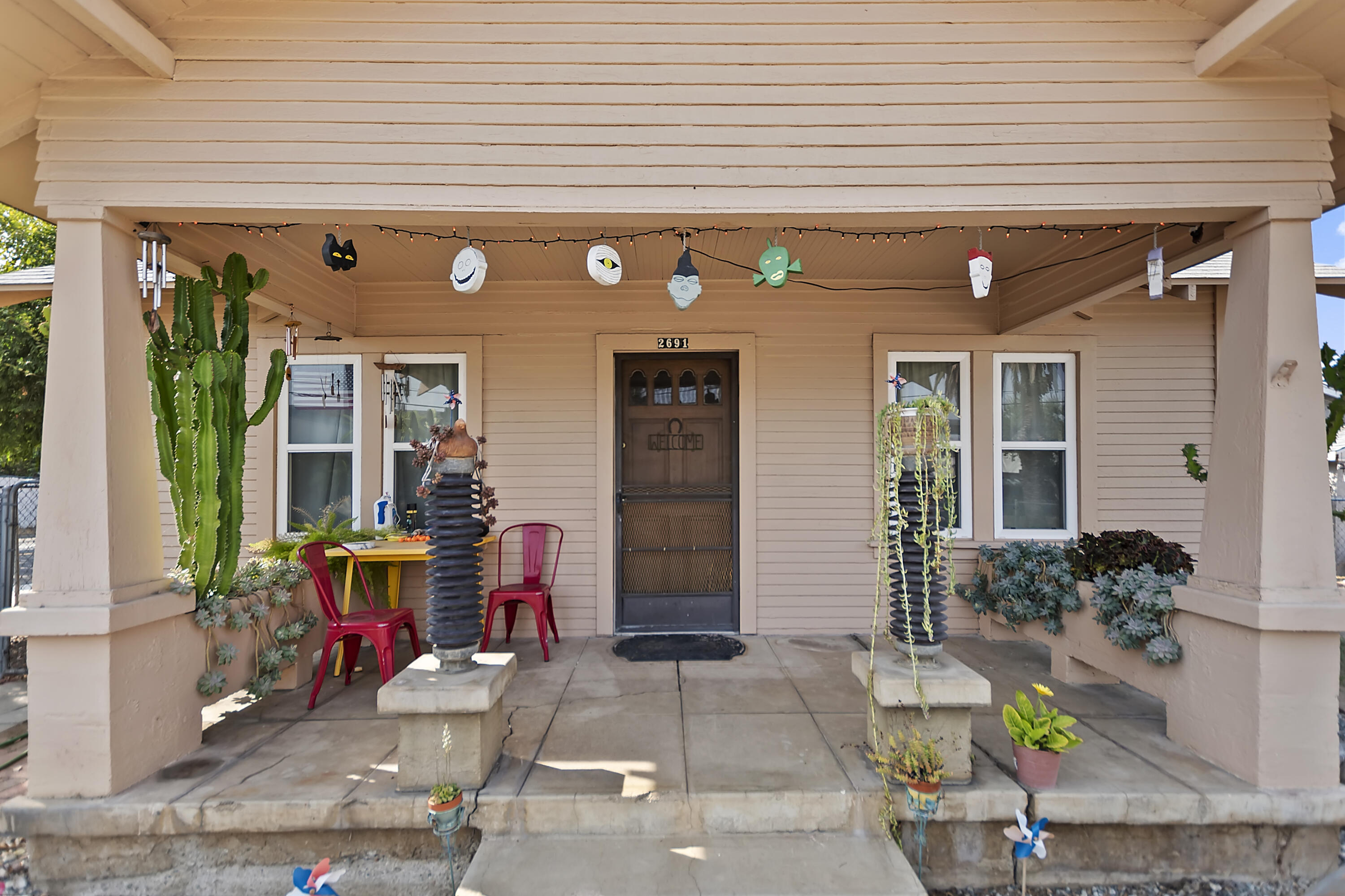 2691 Mulberry Street Riverside, CA 92501 - Photo 1 of 14 a front view of a house with outdoor seating