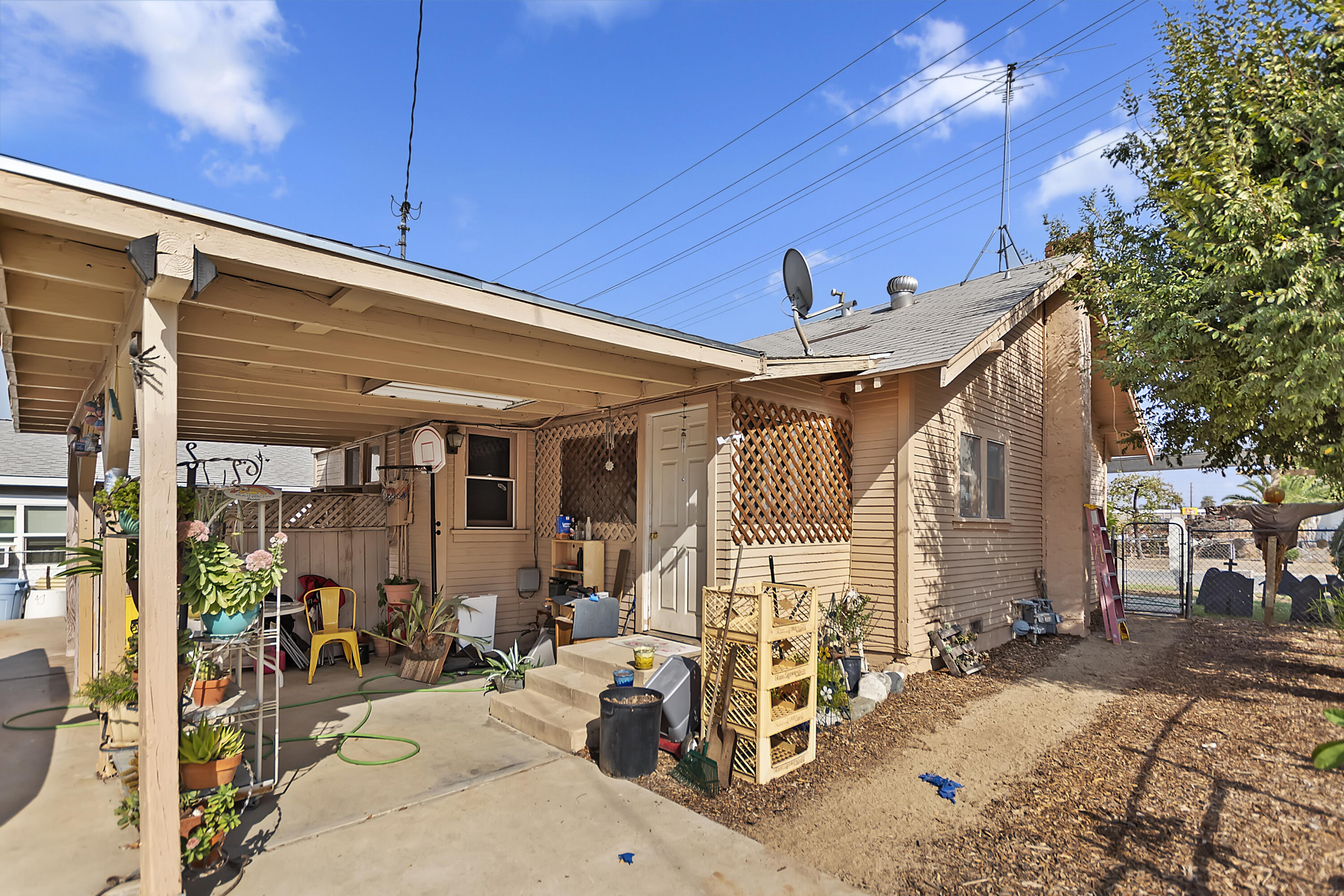 2691 Mulberry Street Riverside, CA 92501 - Photo 13 of 14 a view of the patio with dining table and chairs under an umbrella