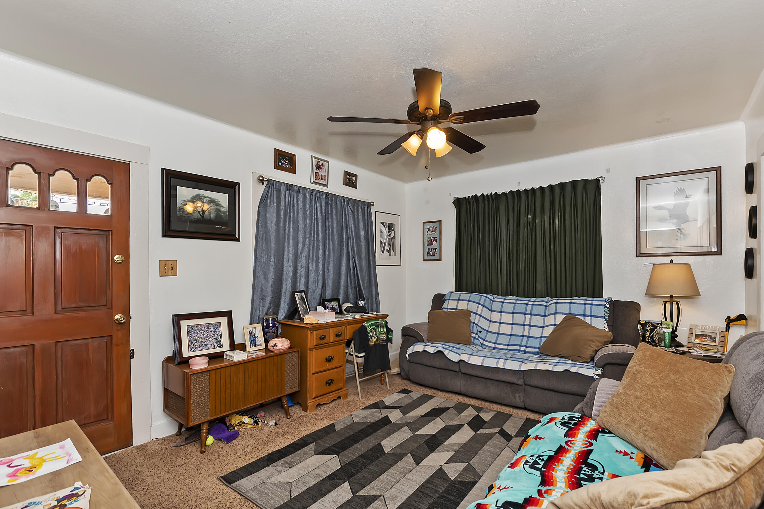 2691 Mulberry Street Riverside, CA 92501 - Photo 3 of 14 a living room with furniture fireplace and a window