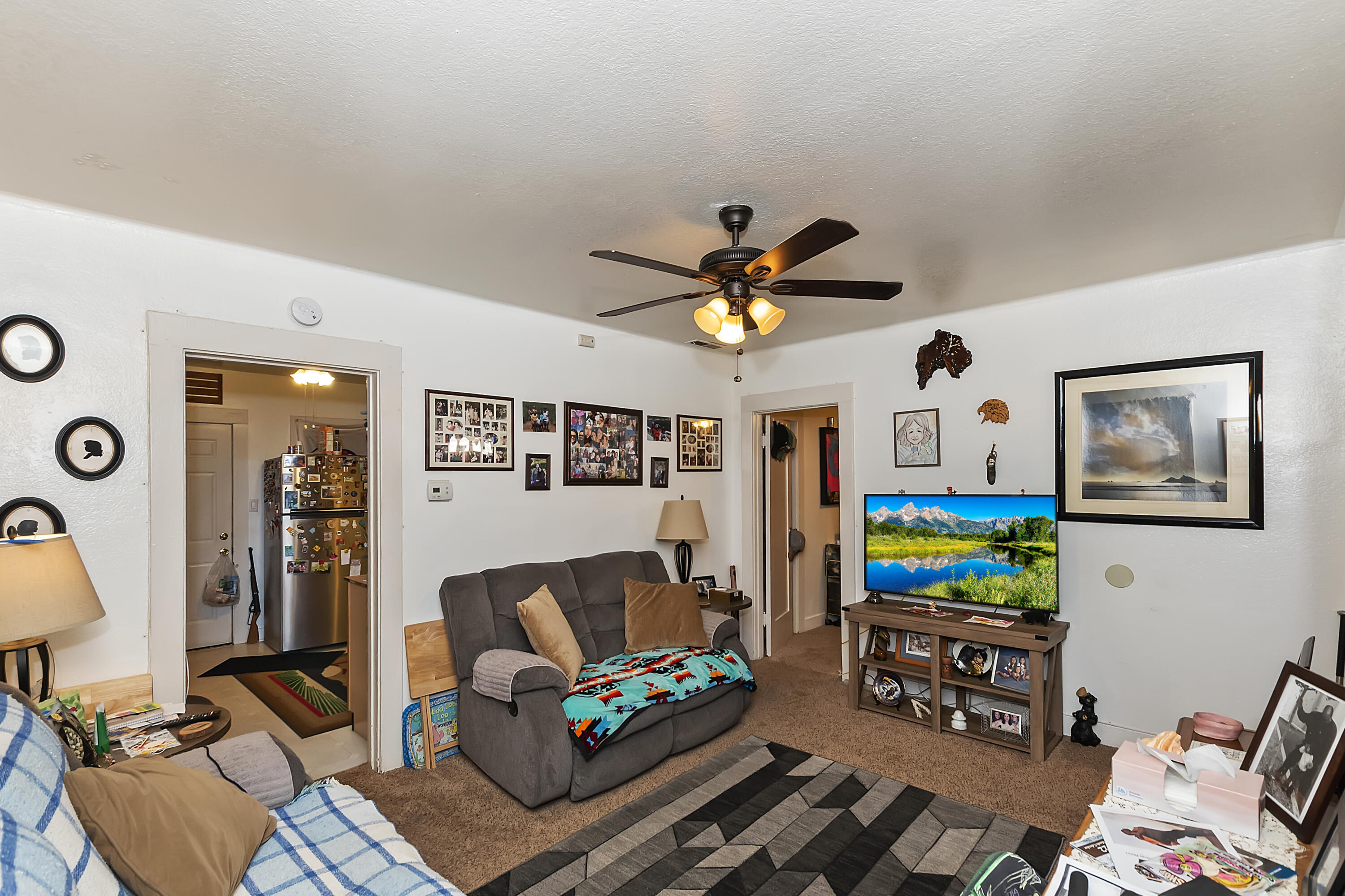 2691 Mulberry Street Riverside, CA 92501 - Photo 4 of 14 a living room with furniture and a flat screen tv