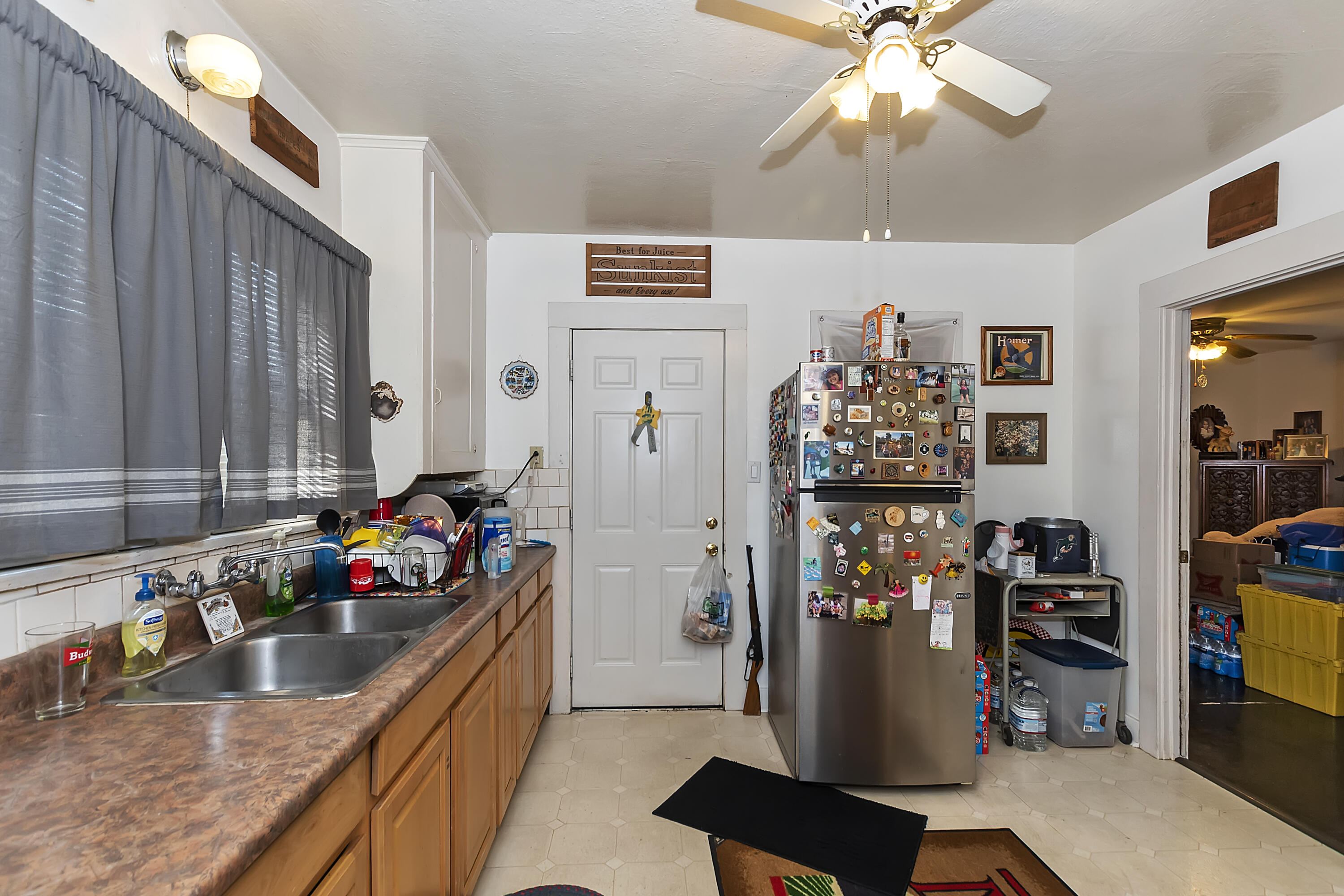2691 Mulberry Street Riverside, CA 92501 - Photo 5 of 14 a kitchen with refrigerator and cabinets