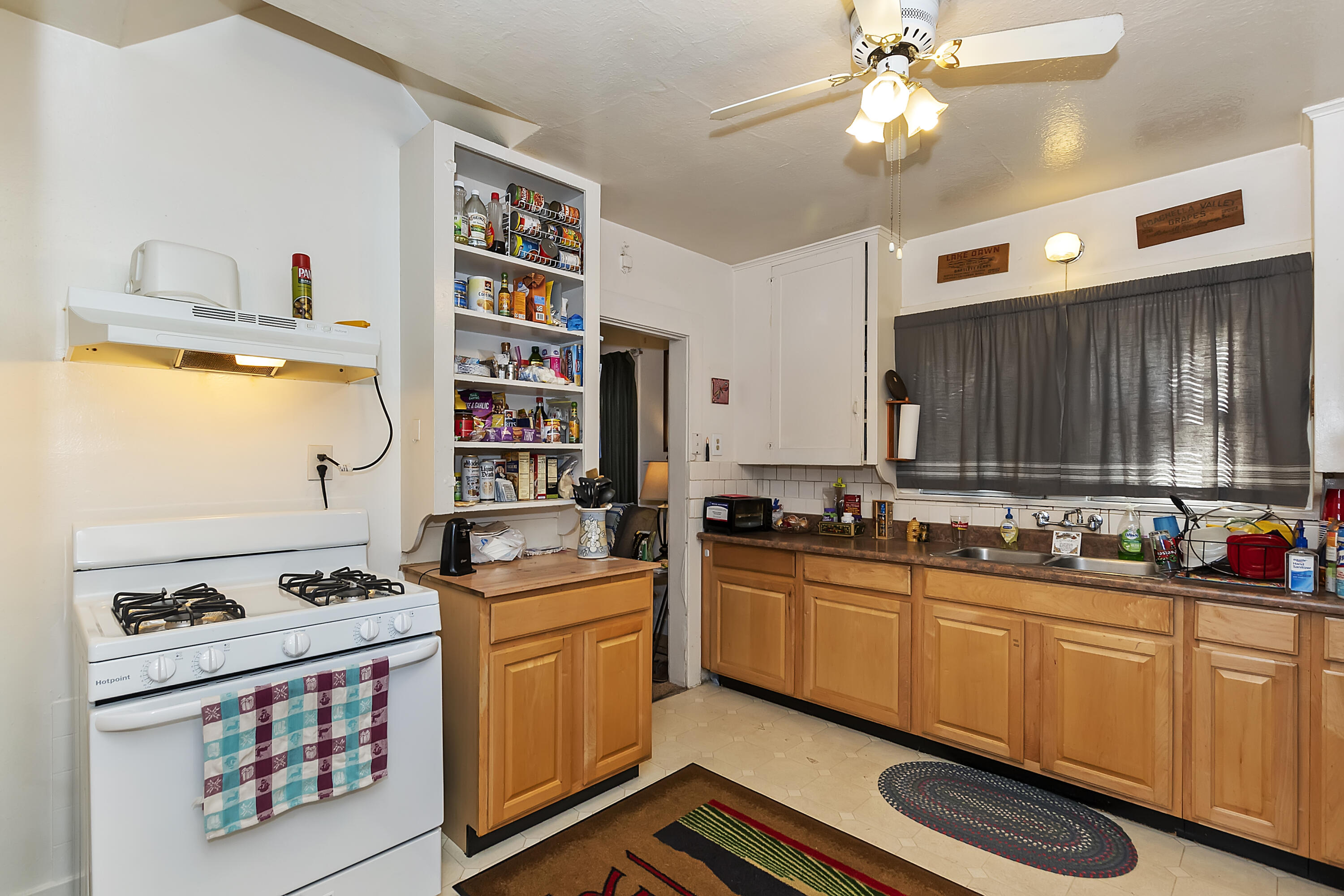 2691 Mulberry Street Riverside, CA 92501 - Photo 6 of 14 a kitchen with stainless steel appliances a stove a sink and a refrigerator