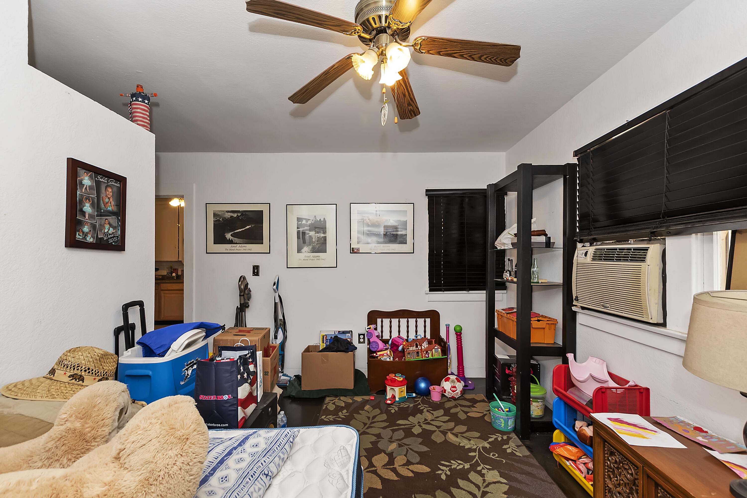 2691 Mulberry Street Riverside, CA 92501 - Photo 8 of 14 a living room filled with furniture and a flat screen tv