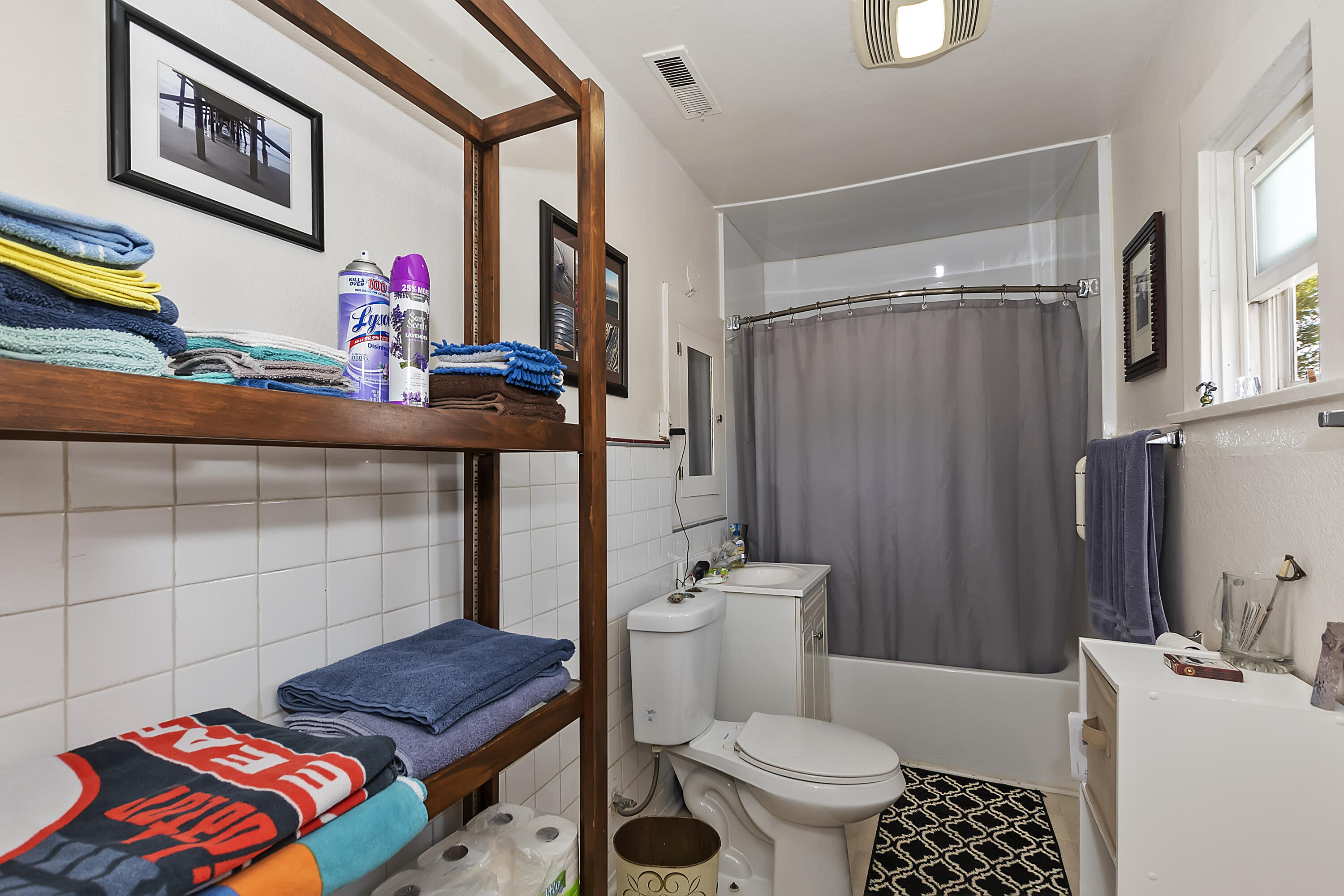2691 Mulberry Street Riverside, CA 92501 - Photo 10 of 14 a bathroom with a toilet a sink and a shower