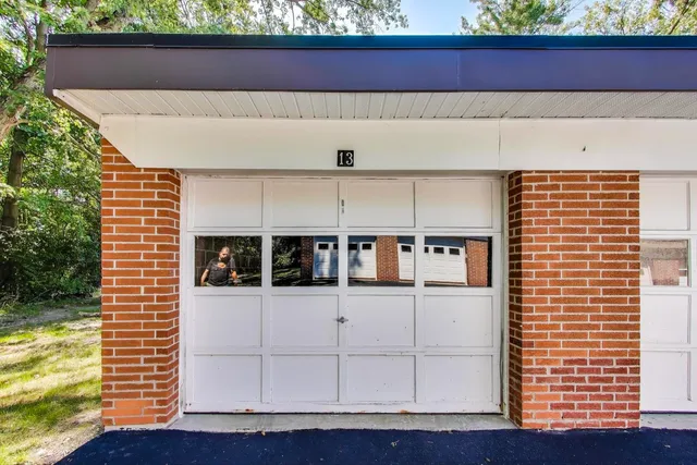 a view of a balcony with furniture and wooden floor