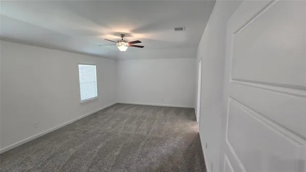 a view of empty room with windows