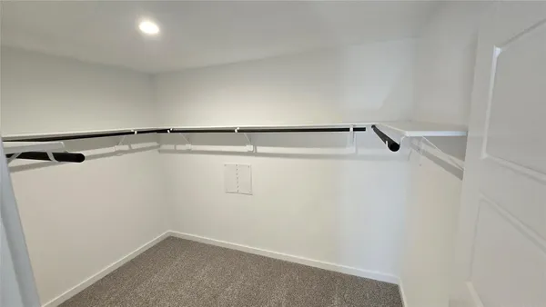a view of a room with racks on the wall