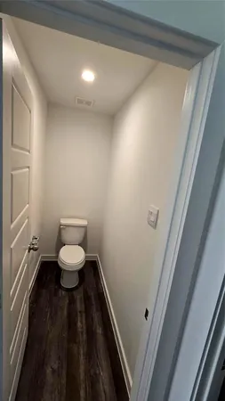 a bathroom with a toilet and a sink