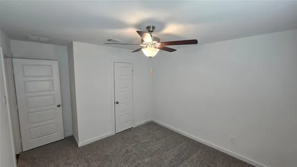 a very nice looking room with a fan