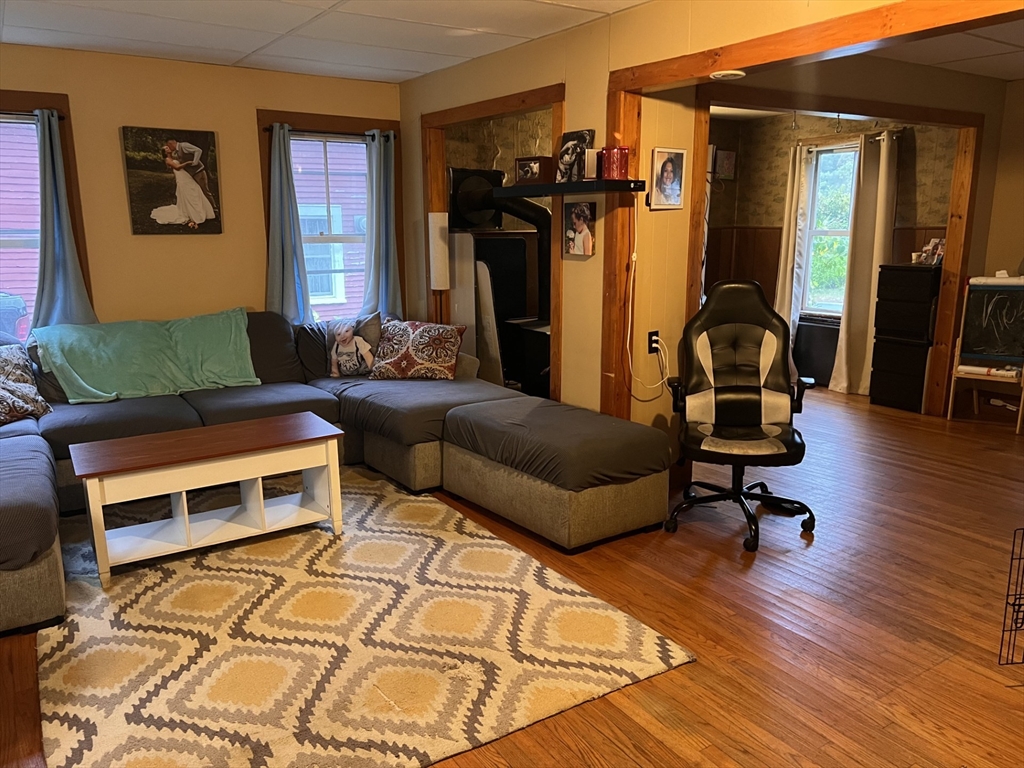 120 Main Road Colrain, MA 01340 - Photo 3 of 31 a living room with furniture a flat screen tv and a window