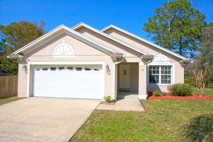 60 Bonita Road DeBary, FL 32713 - Photo 1 of 1 a front view of a house with garden