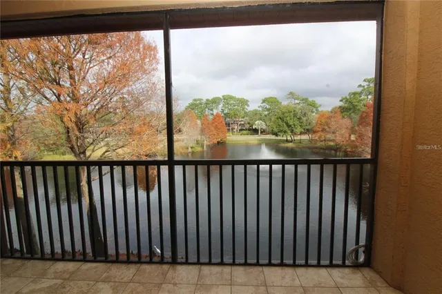 a view of balcony with wooden floor