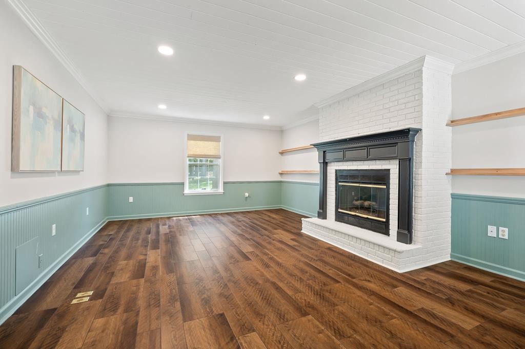 480 Jamestown Road Cookeville, TN 38501 - Photo 17 of 46 a view of empty room with a fireplace and wooden floor
