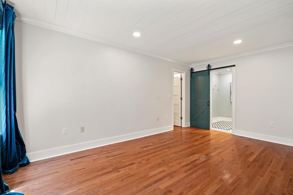 480 Jamestown Road Cookeville, TN 38501 - Photo 20 of 46 a view of an empty room with wooden floor and a window