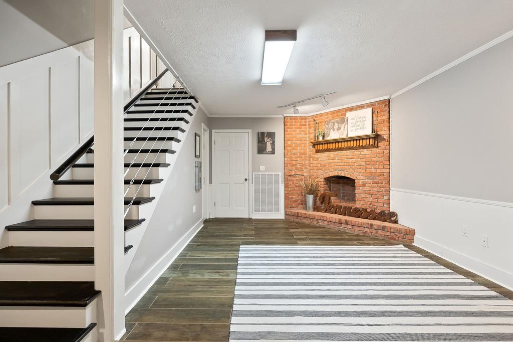 480 Jamestown Road Cookeville, TN 38501 - Photo 36 of 46 a view of a livingroom with wooden floor and a fireplace