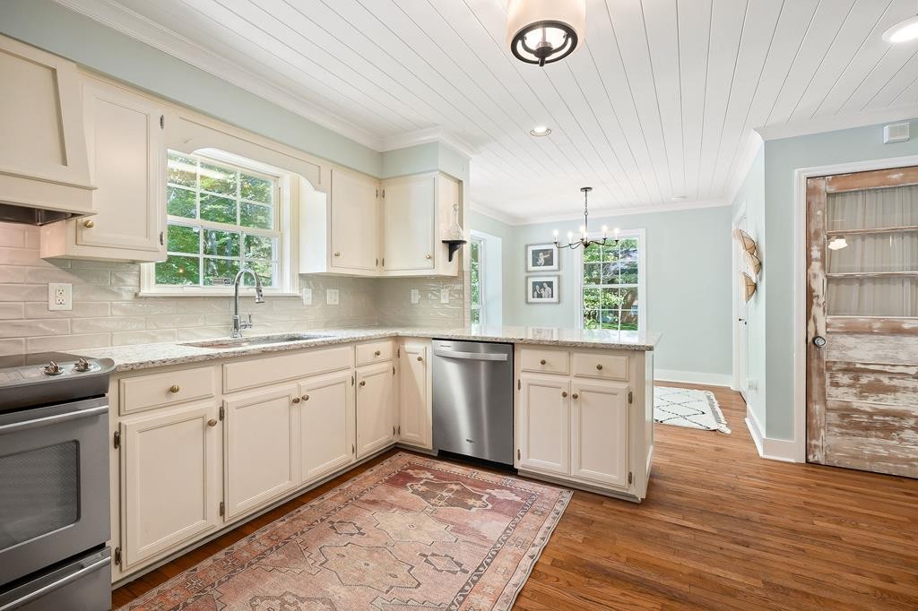 480 Jamestown Road Cookeville, TN 38501 - Photo 9 of 46 a kitchen with granite countertop a sink cabinets window and stainless steel appliances