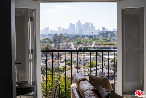 a view of a balcony with furniture