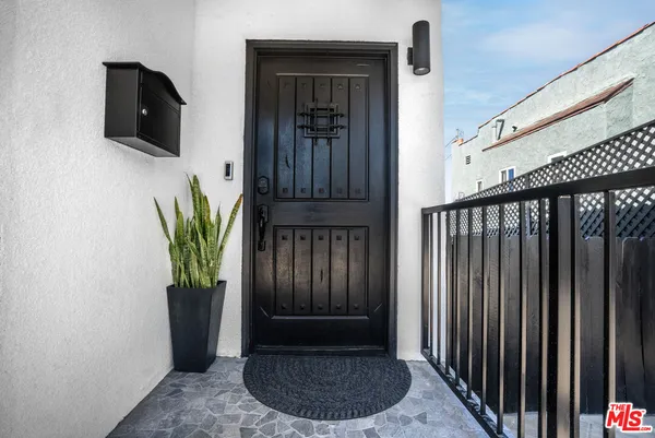 a view of entryway with wooden floor
