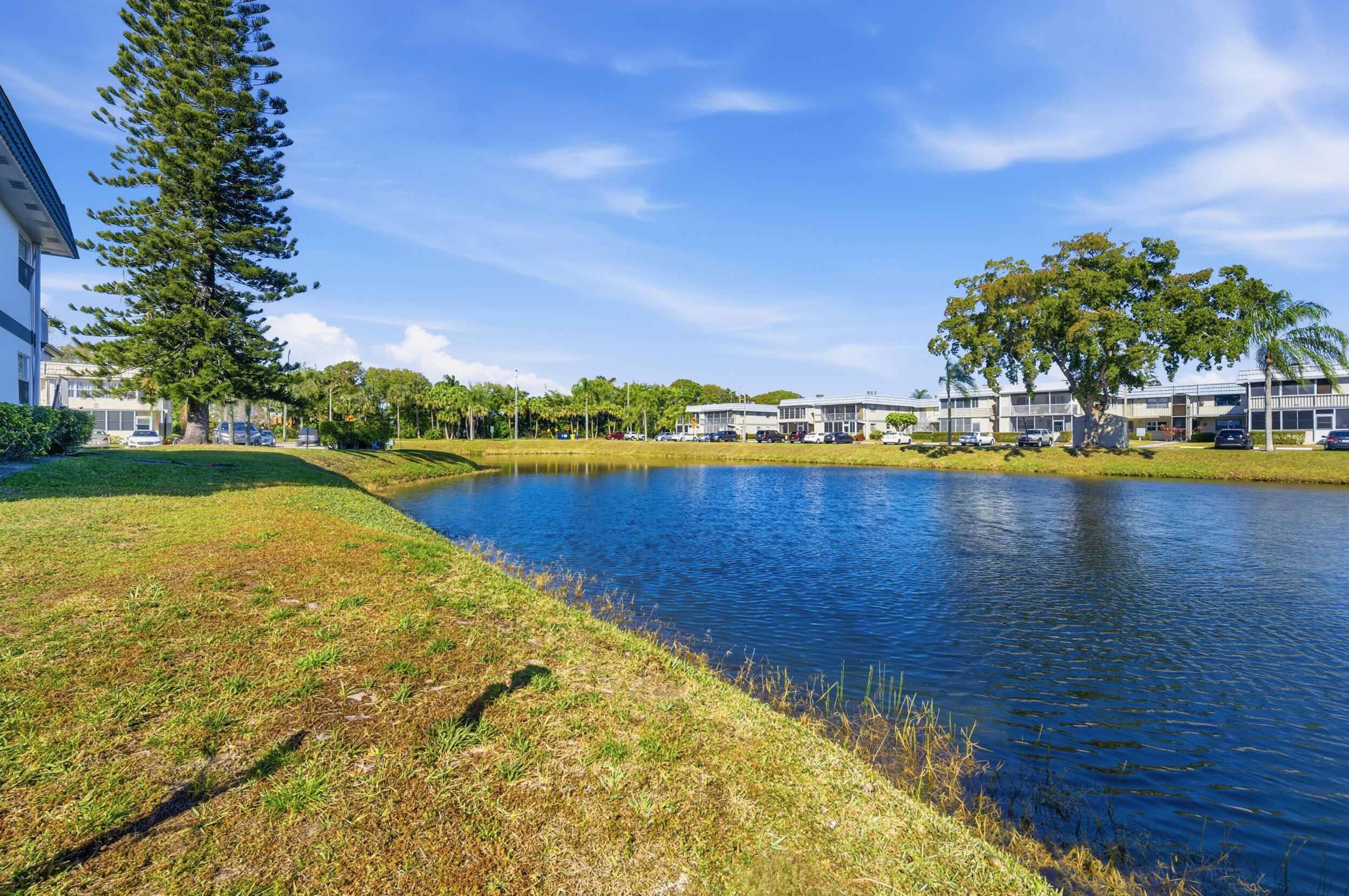 669 Saxony Place Delray Beach, FL 33446 - Photo 11 of 34 a view of a swimming pool with an outdoor space and seating area