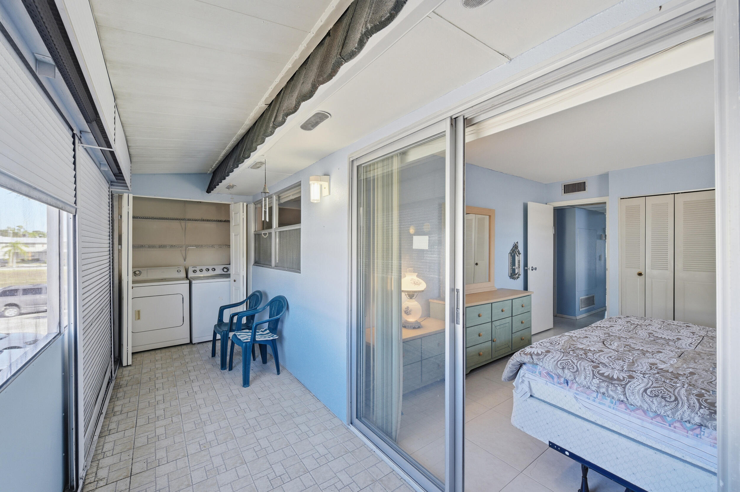 669 Saxony Place Delray Beach, FL 33446 - Photo 16 of 34 a bedroom with furniture and a window