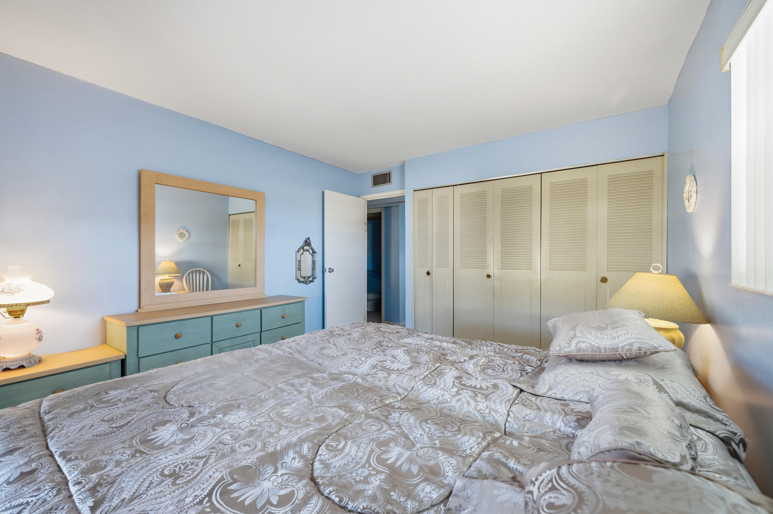 669 Saxony Place Delray Beach, FL 33446 - Photo 17 of 34 a bedroom with a large bed and a window