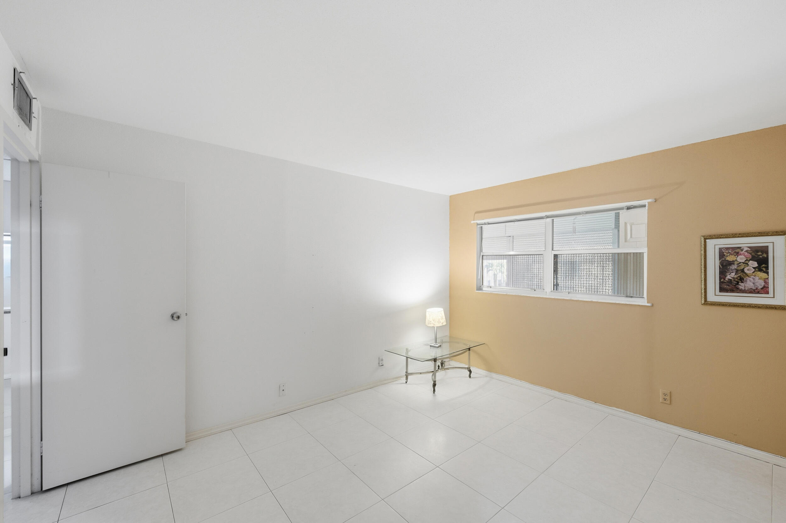 669 Saxony Place Delray Beach, FL 33446 - Photo 20 of 34 a view of an empty room with a window