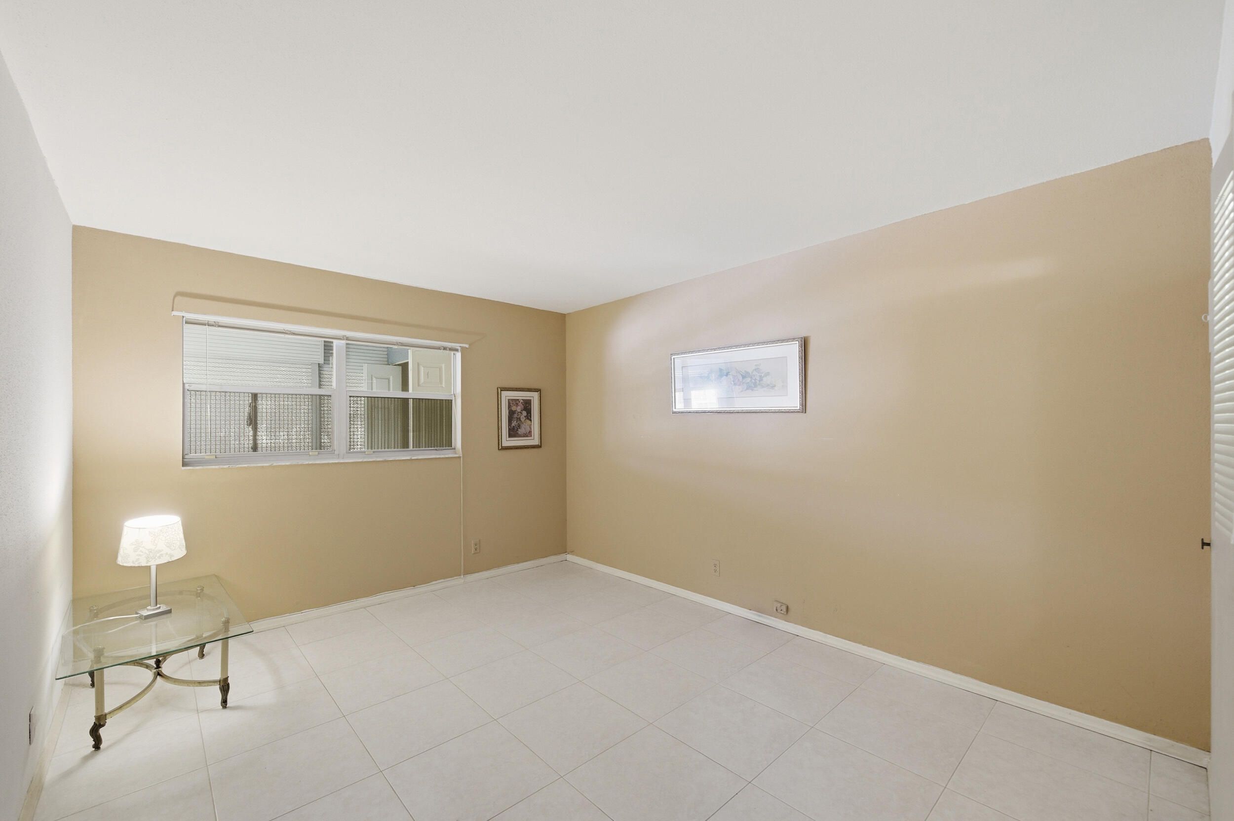 669 Saxony Place Delray Beach, FL 33446 - Photo 23 of 34 a view of an empty room with a window