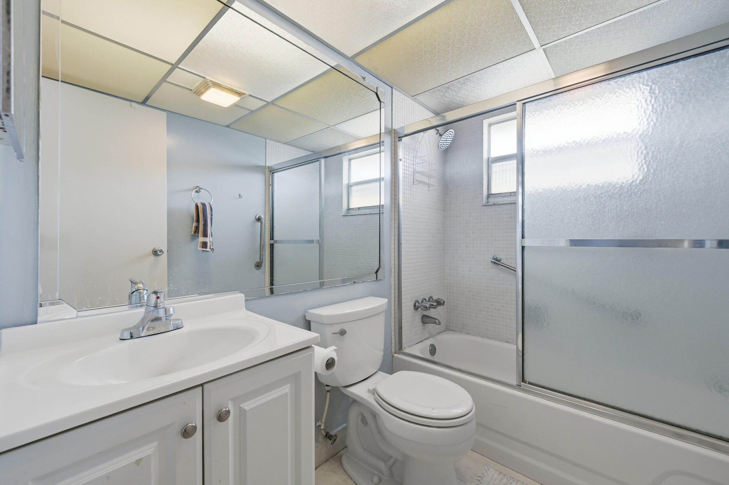 669 Saxony Place Delray Beach, FL 33446 - Photo 26 of 34 a bathroom with a sink toilet and shower
