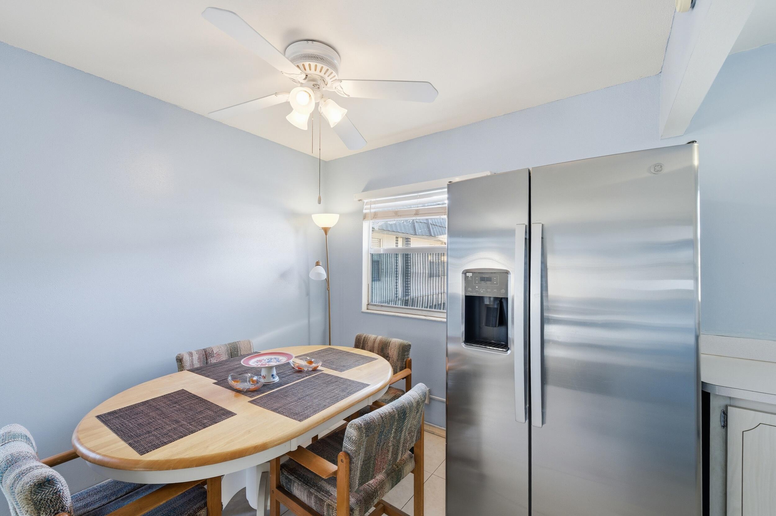 669 Saxony Place Delray Beach, FL 33446 - Photo 30 of 34 a view of a dining room with furniture