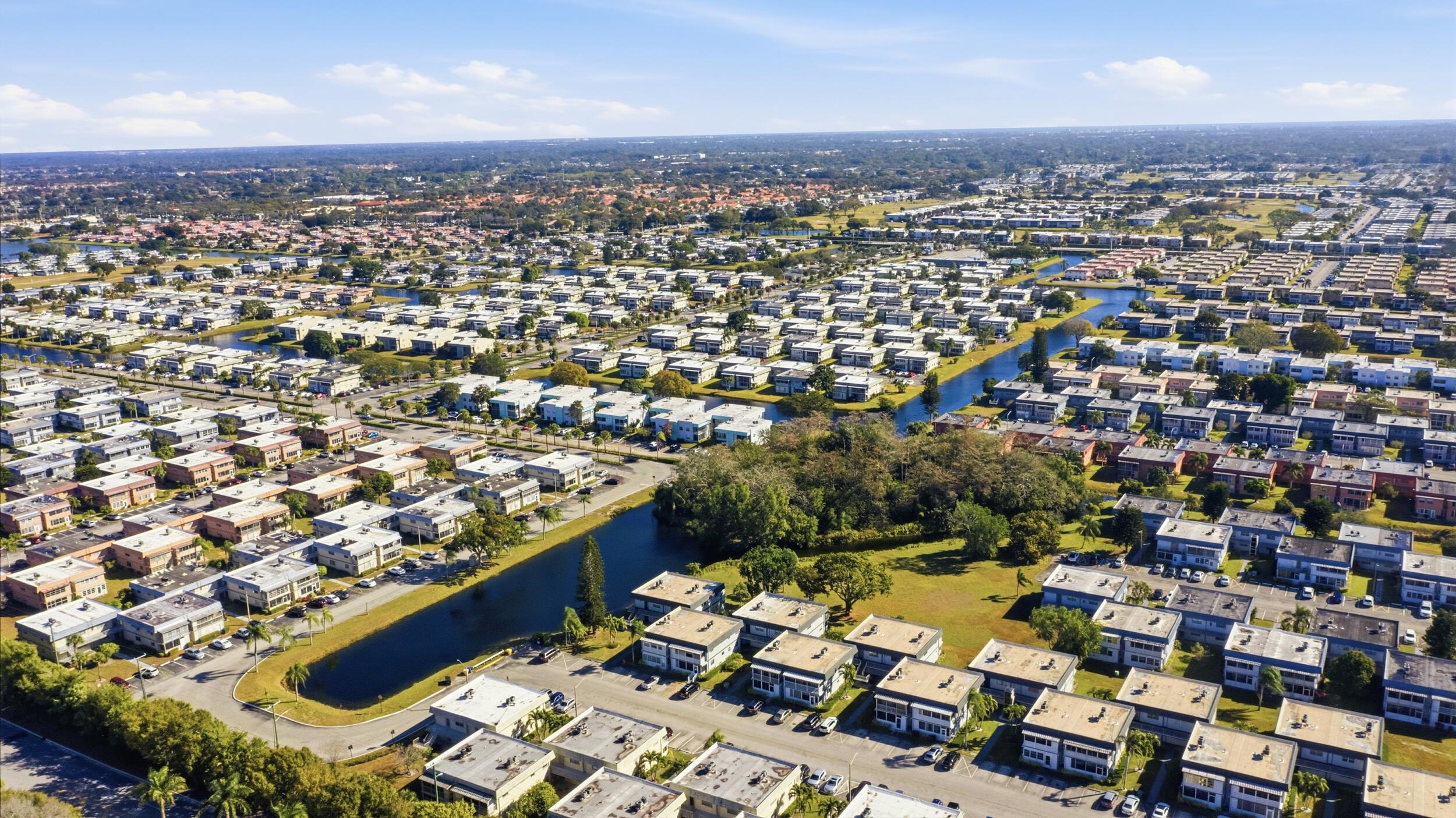 669 Saxony Place Delray Beach, FL 33446 - Photo 4 of 34 an aerial view of a city