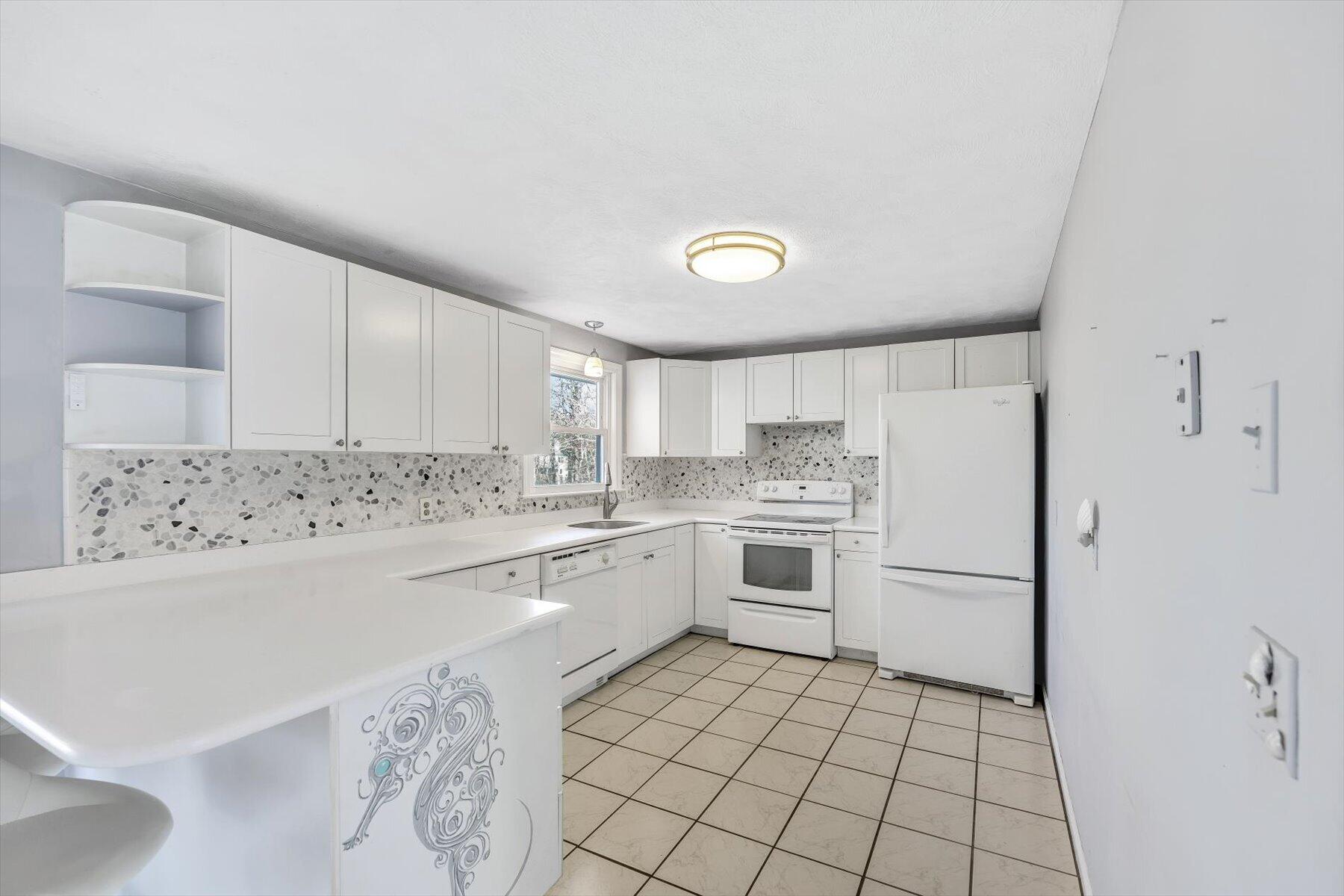 27 Madeline Road East Falmouth, MA 02536 - Photo 13 of 43 a kitchen with a cabinets and white appliances