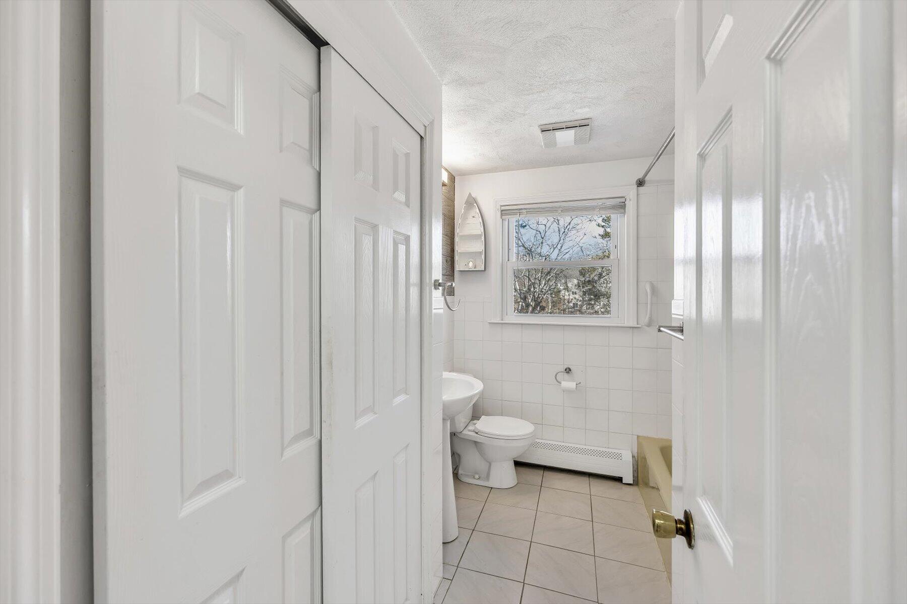 27 Madeline Road East Falmouth, MA 02536 - Photo 19 of 43 a bathroom with a toilet and a shower