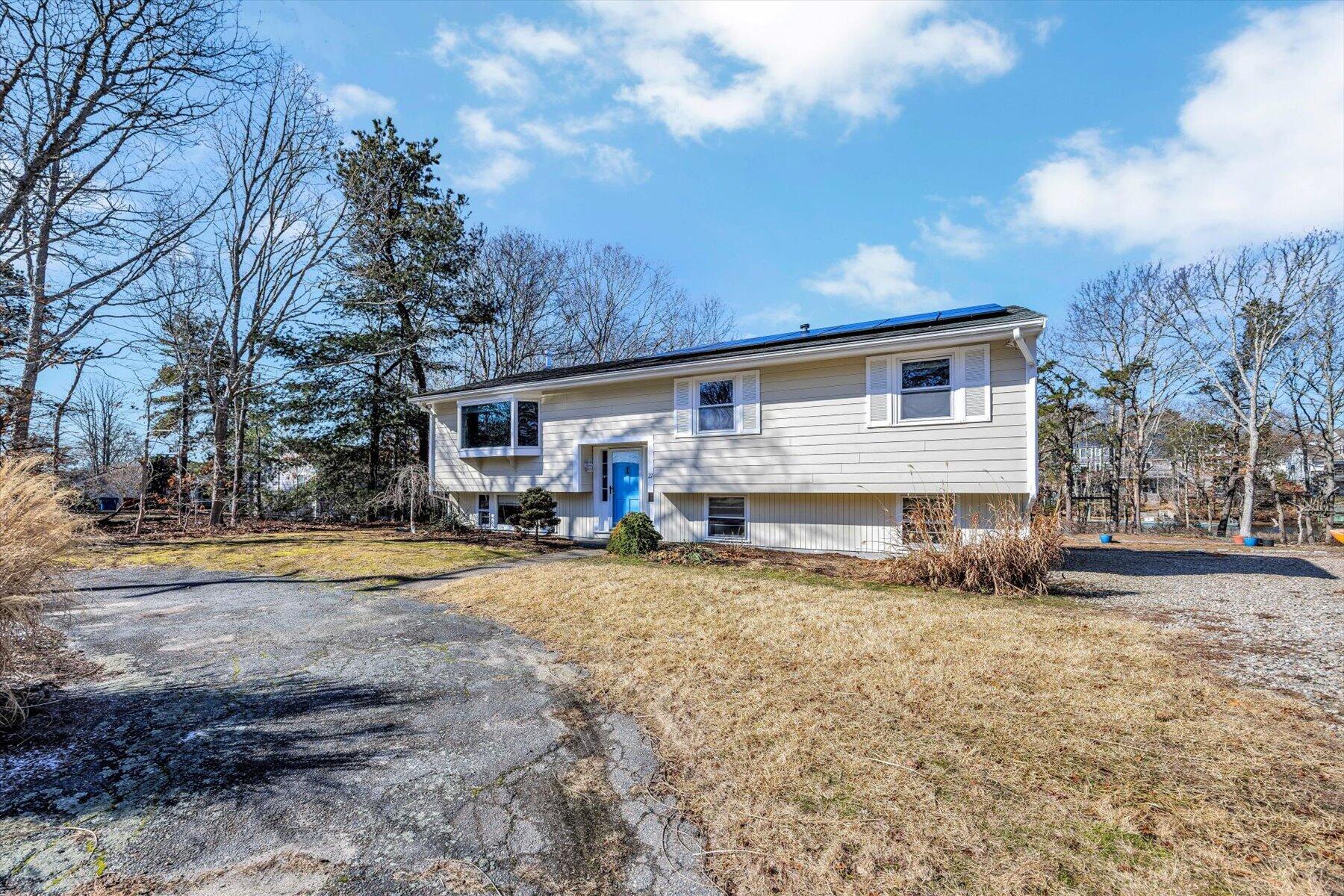 27 Madeline Road East Falmouth, MA 02536 - Photo 2 of 43 a view of a house with snow on the side of the road