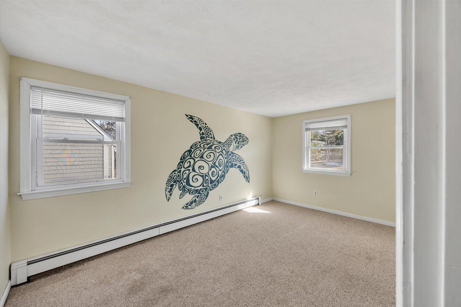 27 Madeline Road East Falmouth, MA 02536 - Photo 21 of 43 a view of an empty room with a window and closet