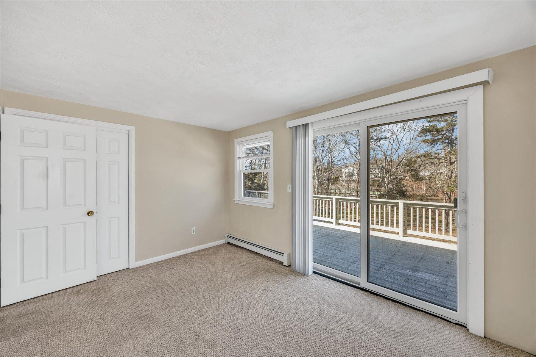 27 Madeline Road East Falmouth, MA 02536 - Photo 25 of 43 an empty room with sliding glass door and mountain view